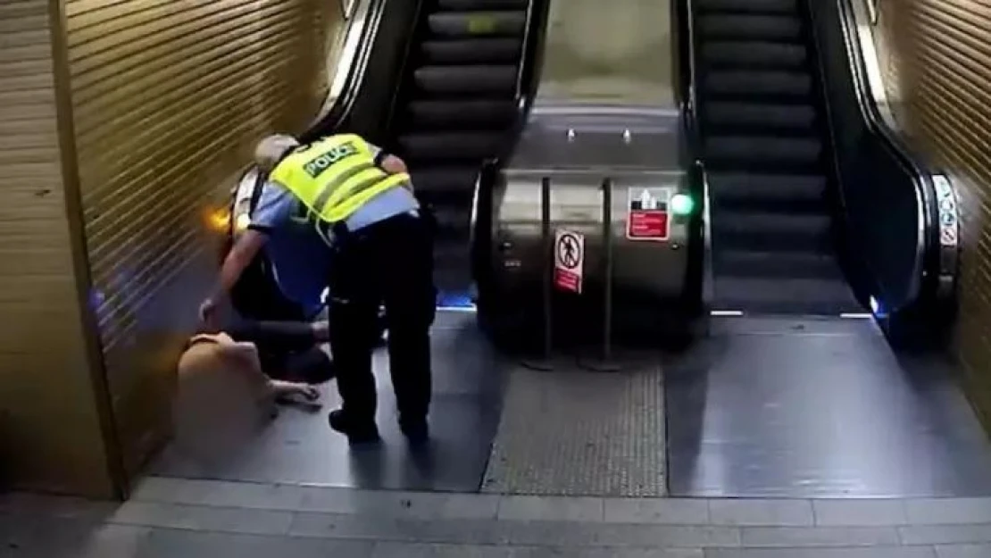 Yürüyen merdivene ters binen hırsız polis tarafından yakalandı